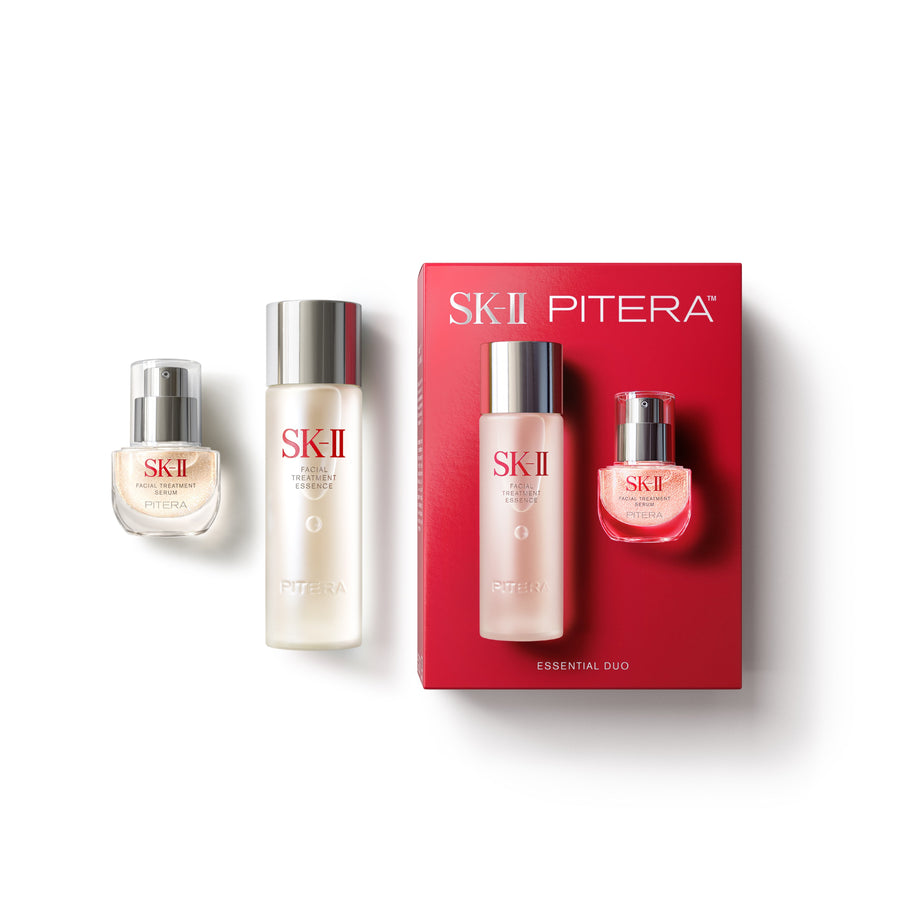 SK-II Pitera Essential Oud gift set featuring a red box and two glass bottles with silver caps, displayed on a clean white background.